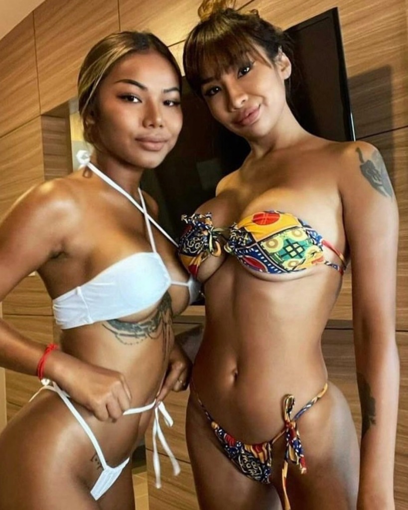 2 Thai women in bikinis ready for the beach